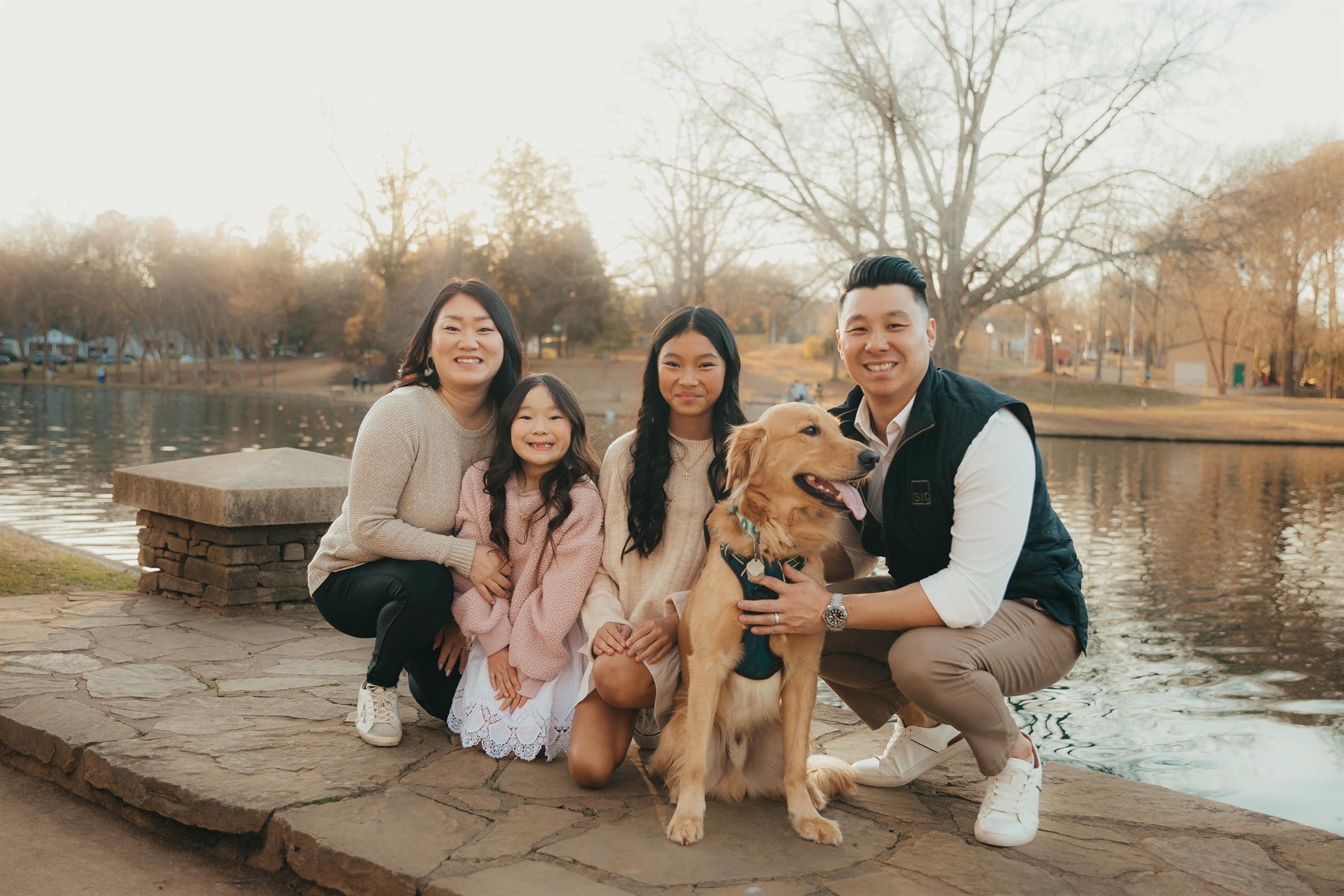 Founder Nate Sahlman with his wife, daughters and their golden retriever at a Charlotte park